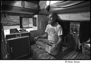 Ram Dass in his van, meditating