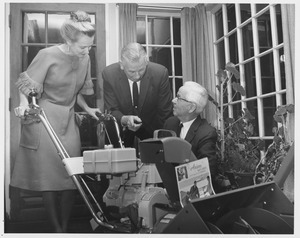 Harvey L. Sweetman with snow thrower and unidentified man and woman