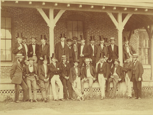 Members of class of 1871 standing outdoors, in front of building