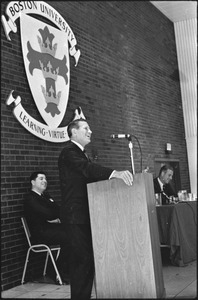Governor Volpe and Elliot Richardson at Boston University: John Volpe standing at a podium and laughing