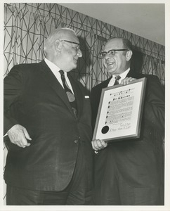 Dr. DiMichael presenting Dr. Frank Krusen with the George G. Deaver award