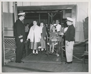 Women with disabilities boarding boat