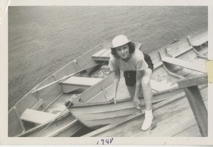 Bernice Kahn disembarking from a dinghy at Camp Annisquam