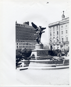 Woman sitting on the George Robert White Memorial Fountain, Boston Public Garden