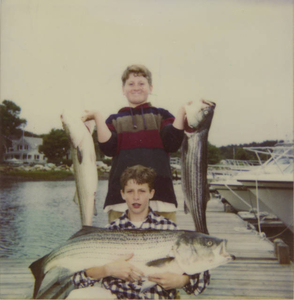 Sam Freed with classmate, catching fish in the North River