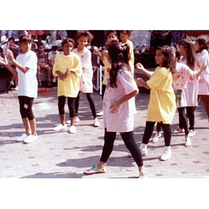 Girls performing for festival goers in the plaza.
