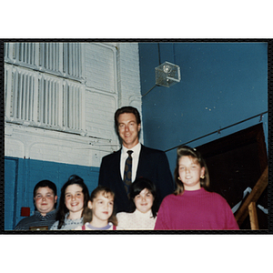 Former Boston Celtic Dave Cowens posing for a group picture with a boy and four girls at a Kiwanis Awards Night