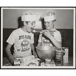 Two members of the Tom Pappas Chefs' Club pose during baking preparation