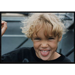 A girl poses for a candid shot on a boat