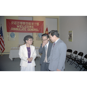 Suzanne Lee chats with two members of the visiting Consulate General of the People's Republic of China at a welcome party held for the visitors in Boston