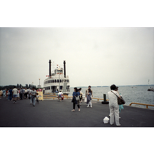 Ferry boat and crowded pier near Toronto, Ontario