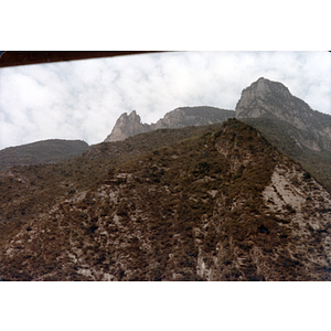 Mountainside topped with rocky peaks