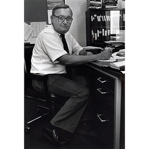 Barry Karger, professor of chemistry, at his desk