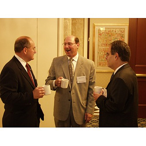 Vincent DiCenso, CBA '62, left, and Abbot Gilman, CBA '76, center, before the College of Business Administration's CEO Breakfast Forum at The Colonnade