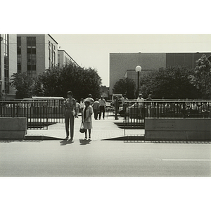 Two women waiting to cross Huntington Avenue