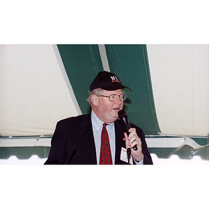 Neal F. Finnegan speaks at a Harvard football game