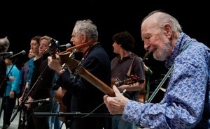 Pete Seeger (far right) performing on stage with David Amram (center) and others during the Power of Song Award concert, Symphony Space, New York City