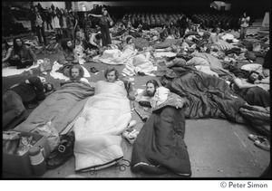 Resting and lying sleeping bags, on the floor of the Winterland Ballroom, at a Ram Dass gathering