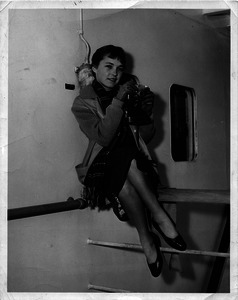 Pat Spaulding and camera aboard ship
