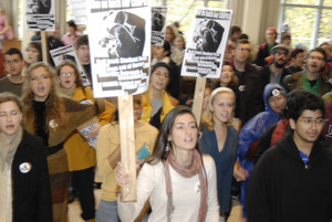 UMass student strike: strikers in the entrance to the Student Union holding signs supporting a general student strike