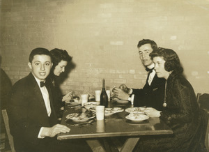 Kirby Hayes and Luther Gare dining with friends