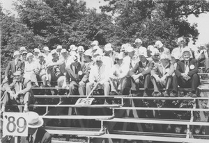 Class of 1924 alumni in athletic field bleachers
