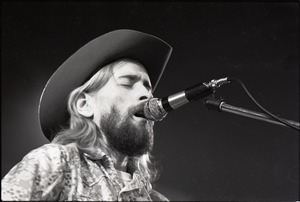 New Riders of the Purple Sage opening for the Grateful Dead at Sargent Gym, Boston University: John 'Marmaduke' Dawson playing acoustic guitar and signing