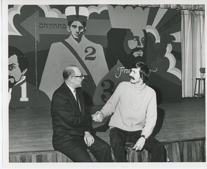 Dr. DiMichael shaking hands with man at Christmas party