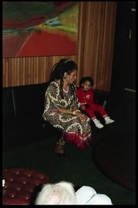 Rosalind Cash: seated next to a young child on a couch