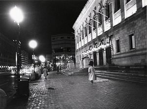 Night scene in front of the Dartmouth Street entrance of the Copley Square Library