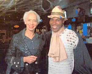 A Photograph of Marlow Monique Dickson and a Friend in a Bar