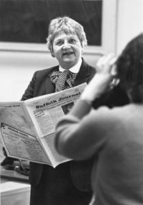 Norma Nathan of the Boston Herald holds a copy of the Suffolk Journal during a visit to Suffolk University