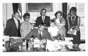 John Joseph Moakley and constituents watch as Massachusetts Governor Frank Sargent signs the Fair Housing Bill, 1969