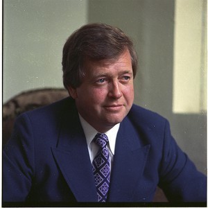 Larry McCoubrey, former BBC TV newsreader, (deceased late 1970s). Alone and with wife and child
