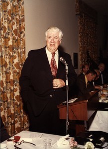 Thomas P. O'Neill speaking at a microphone, hand in pocket