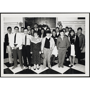 A group of boys and girls posing in front of a wall at the "Recognition Dinner at Harvard Club"