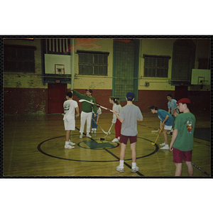 Players prepare for a face off during a floor hockey game