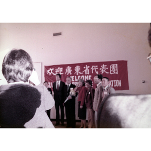 U.S. Senator John Kerry stands with members of the Guangdong Province delegation upon arrival in Boston