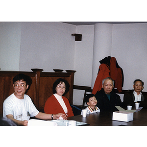 Four Association members sitting at a meeting
