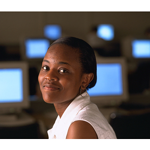 Co-op student seated in front of computers