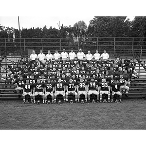 Football team photograph on bleachers