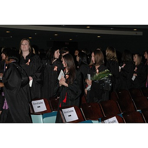 Students stand at School of Nursing convocation