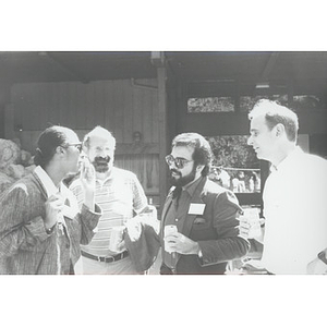 Four faculty members talking at the School of Law orientation, 1991