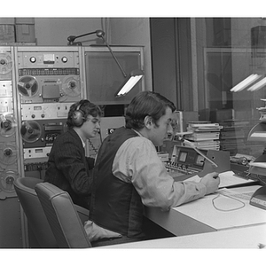 Students working in WNEU Radio broadcast booth