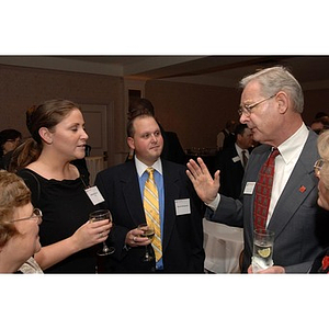 Dick Power talks with guests at the Alumni Ball