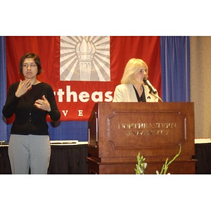 Karen T. Rigg and an American Sign Language interpreter at the Student Activities Banquet