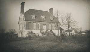 House at Bladensburg with two bare trees on right