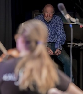 Pete Seeger looking on at other musicians at the George Wein tribute, Symphony Space, New York City