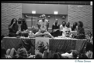 Ram Dass and associates on stage during an appearance at the College of Marin