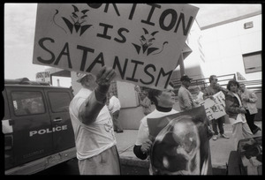 Pro-life protester with sing 'Abortion is Satanism': in front of the Providence Planned Parenthood clinic